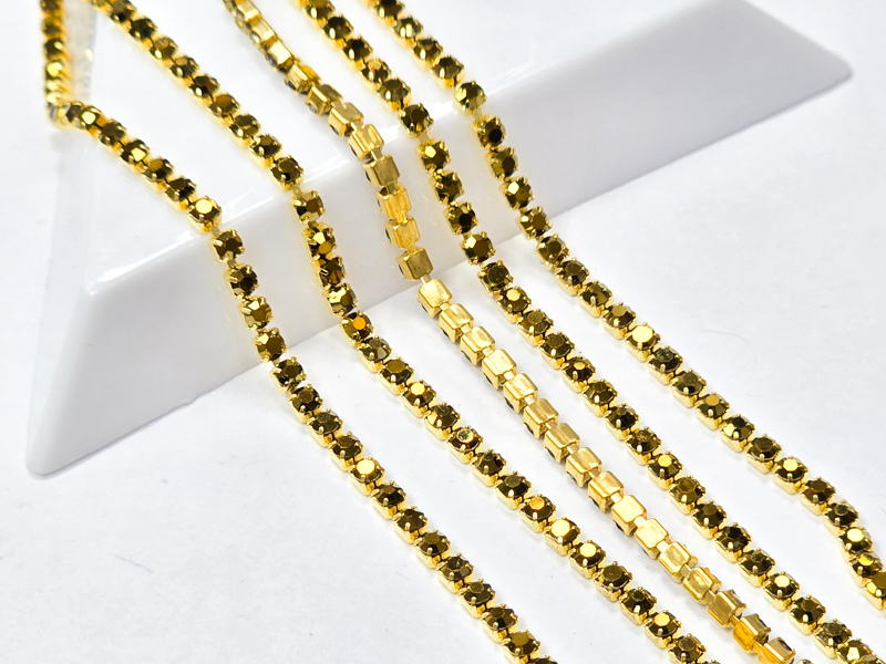 Стразовий ланцюг 2мм основа золота, кристали gold hematite