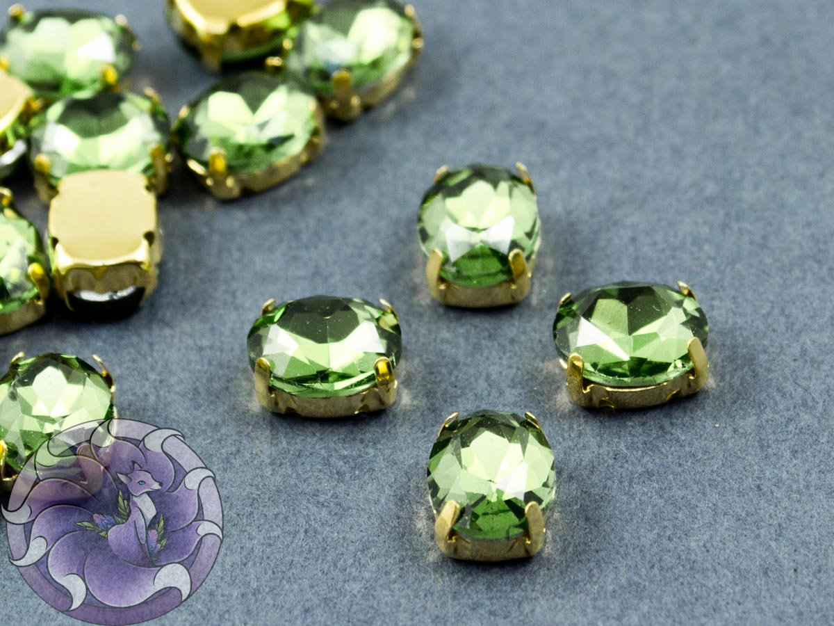 Кристал у золотій оправі Овал 10x8мм Peridot
