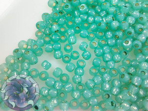 Бісер 5г TOHO Round 11/0 PermaFinish - Silver-Lined Milky Dk Peridot TR-11-PF2119