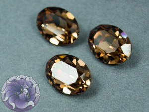 Кристал 4120 Swarovski Овал 18х13мм колір Ligth smoked topaz foiled