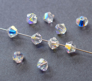 Кришталеві намистини Swarovski біконус 5328, 4мм Crystal AB