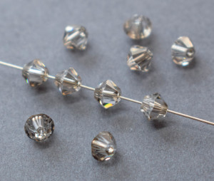 Кришталеві намистини Swarovski біконус 5328, 4мм Grey